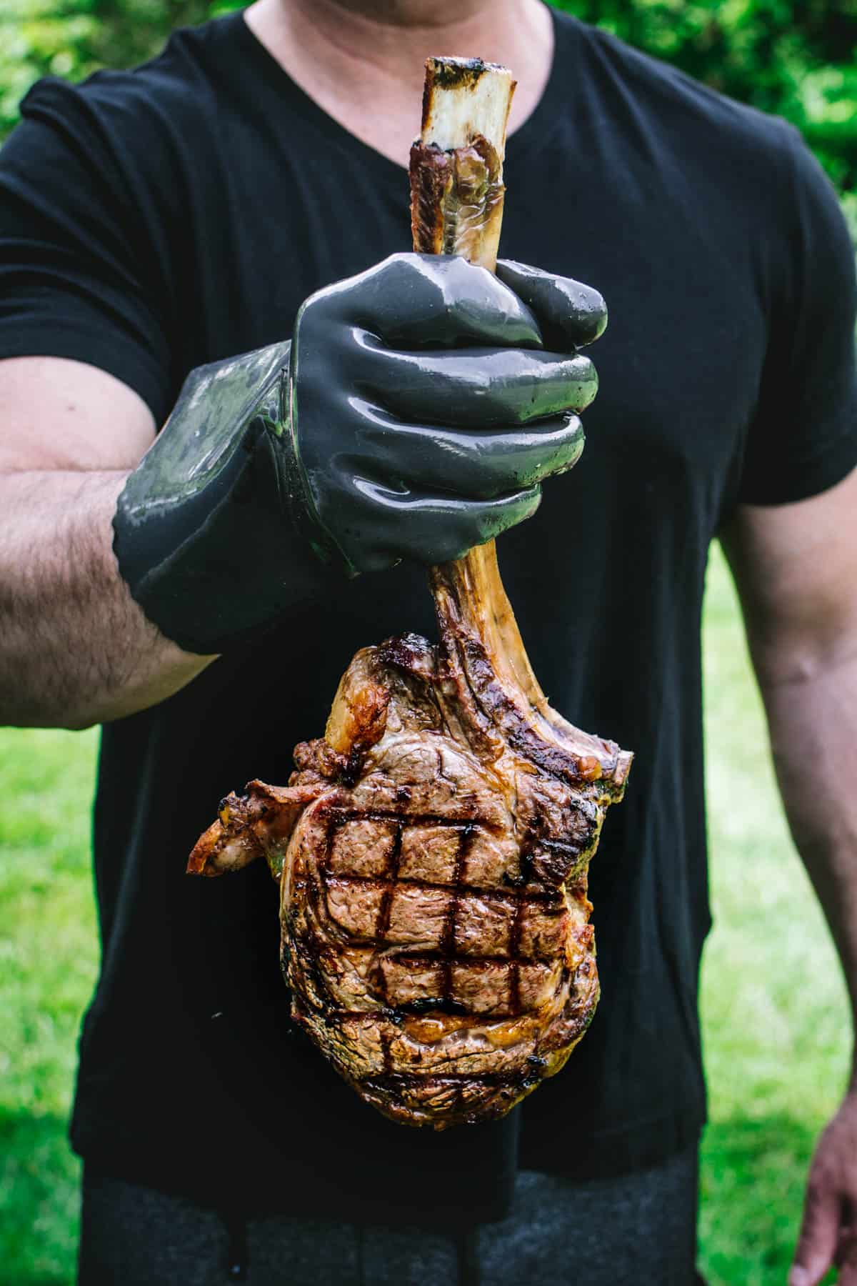 Man holding Tomahawk Steak