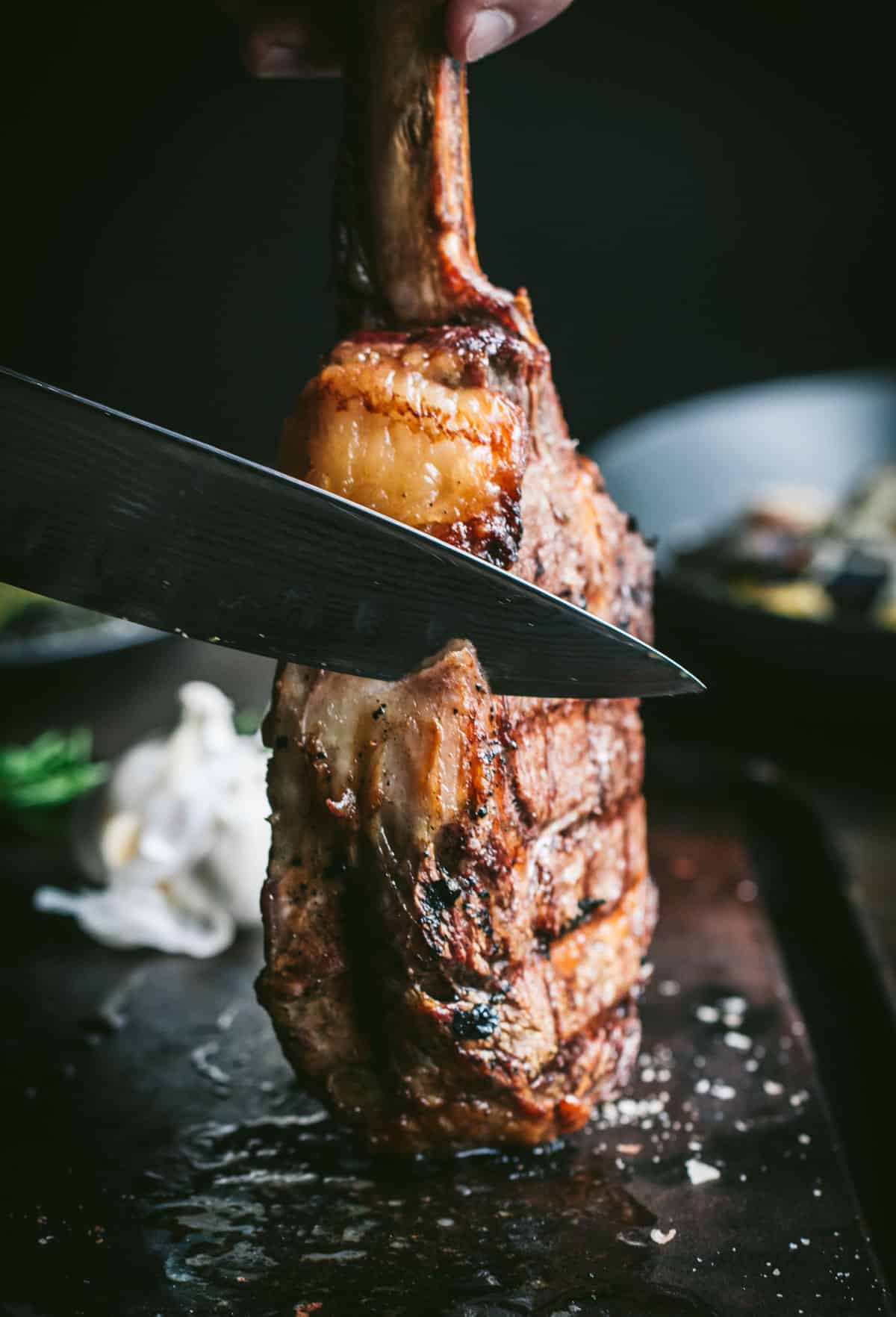 Cutting Tomahawk Steak