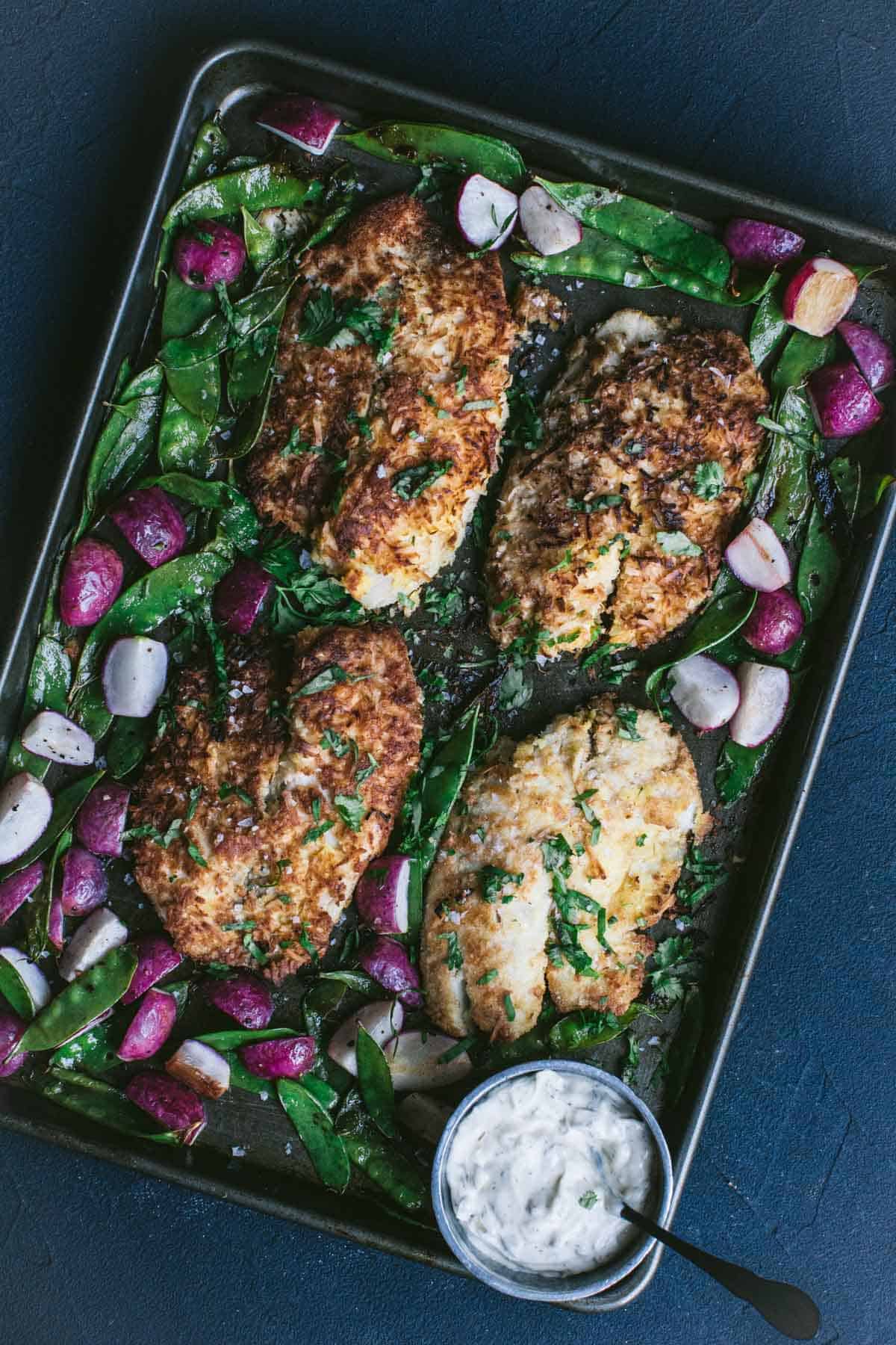 Keto Coconut Crusted Fish with Snap Peas and Radishes.