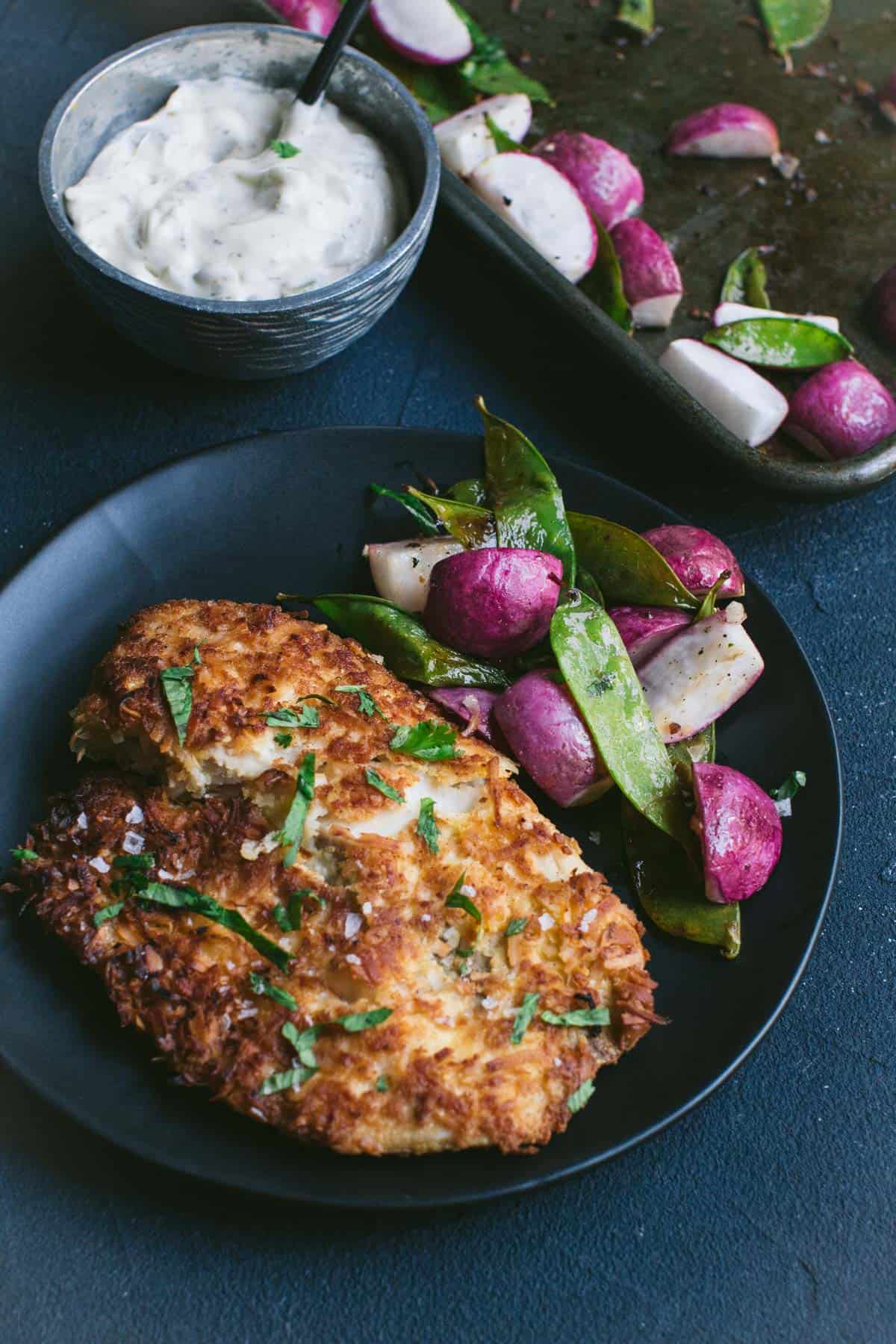 Keto Coconut Crusted Fish with Snap Peas and Radishes.