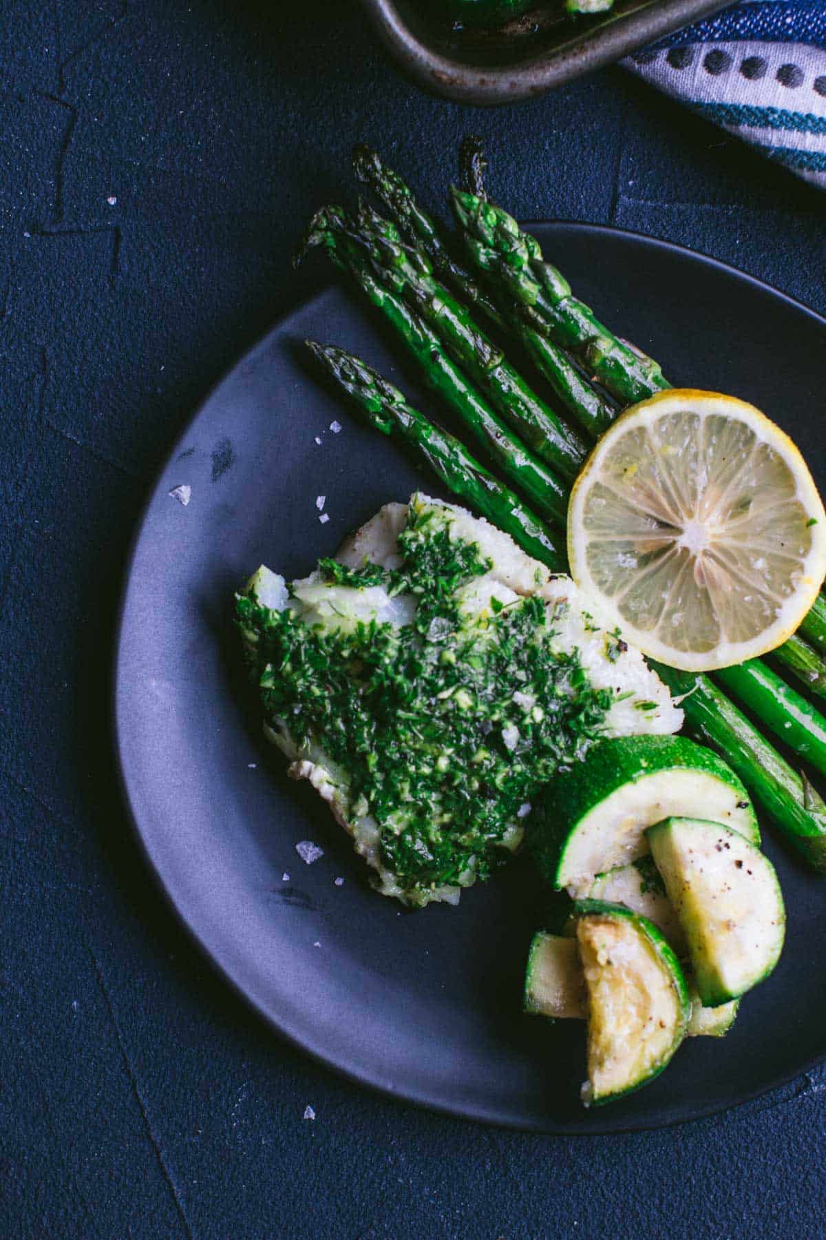 Keto baked Cod with Green Goddess Gremolata on a plate